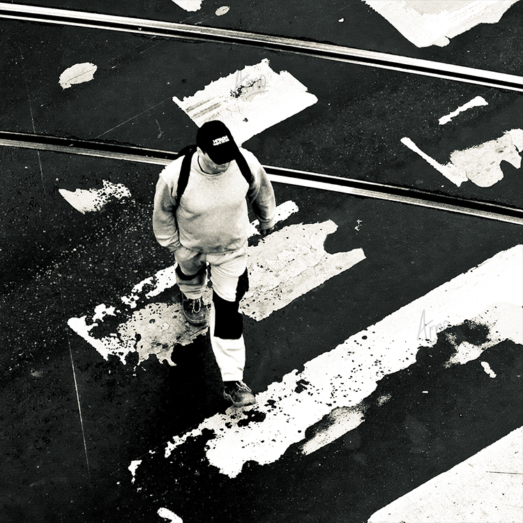 Man crossing a street on a pedestrian crossing