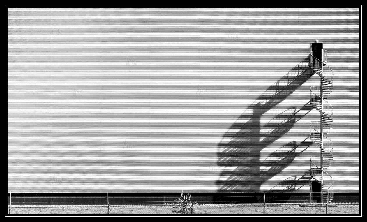 Perfect shadow cast by a staircase outside a building
